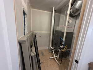 Utility room featuring heating unit