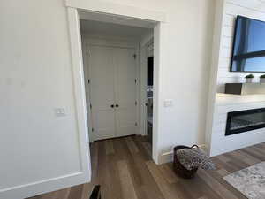 Corridor with dark wood-style flooring
