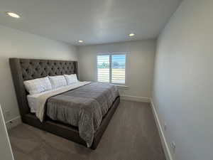 Carpeted bedroom featuring baseboards and recessed lighting