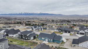 Aerial view of residential area featuring mountains