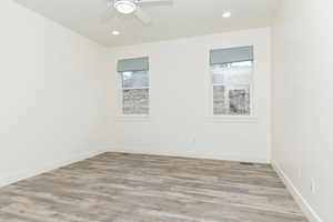 Bedroom with plenty of natural light, light wood-style flooring, recessed lighting, and a ceiling fan