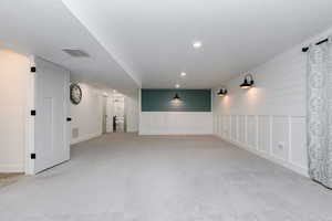 Carpeted family room featuring recessed lighting and baseboards