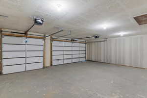 Garage featuring a garage door opener