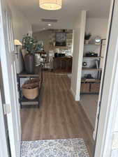 Photos are of staged model home.  Front entry Corridor with wood finished floors