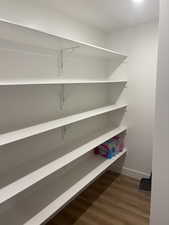 Photos are of staged model home. View of inside of kitchen pantry