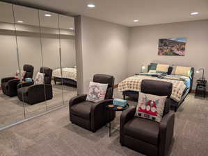 Bedroom featuring a closet, light colored carpet, and recessed lighting