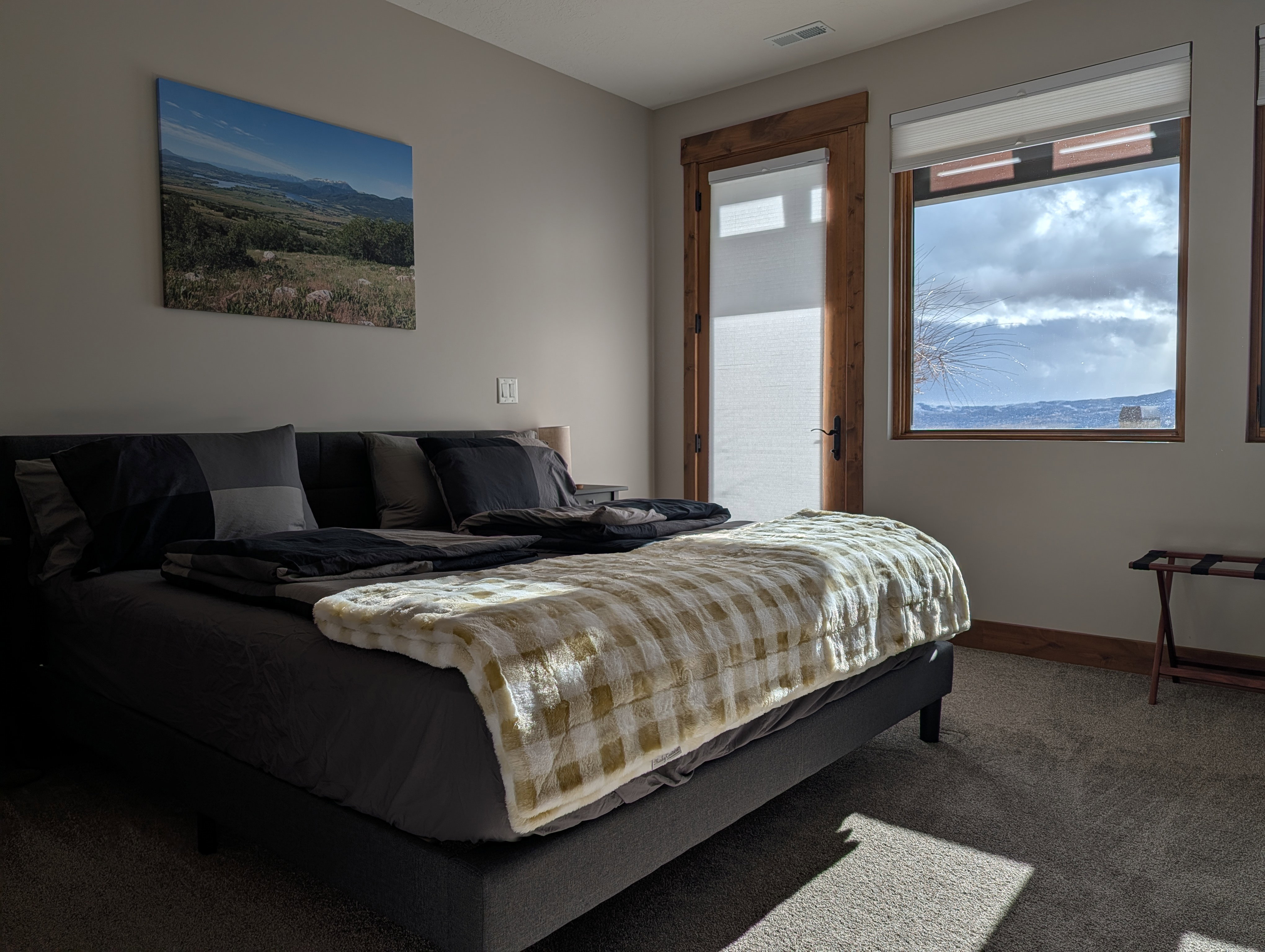 Bedroom with access to exterior and carpet