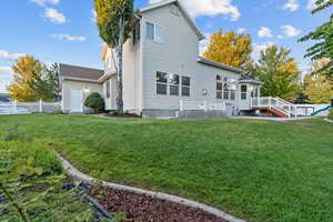 Rear view of house with a wooden deck