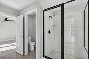 Bathroom featuring a stall shower and tile patterned flooring
