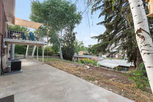 View of patio / terrace with stairs and a wooden deck