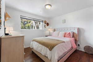 Bedroom featuring dark wood-style floors