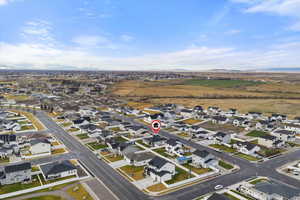 Aerial view of property's location featuring nearby suburban area