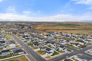 Aerial overview of property's location with nearby suburban area