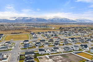 Aerial view of residential area featuring a mountain backdrop