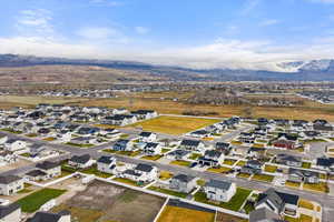 Aerial perspective of suburban area featuring a mountainous background