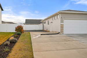View of home's exterior with stone siding and stucco siding
