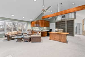 Living area featuring light carpet, recessed lighting, ceiling fan, high vaulted ceiling, and an office area