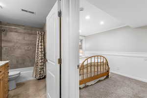 Bedroom with light carpet, a textured ceiling, crown molding, and recessed lighting
