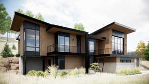 Rear view of property featuring a balcony and stucco siding