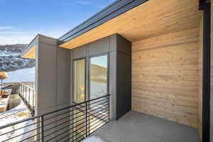 View of snow covered back of property