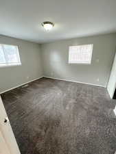 Carpeted empty room with plenty of natural light