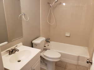 Full bathroom with vanity, tub / shower combination, and light tile patterned floors