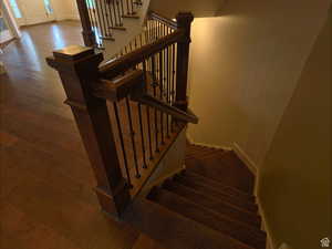 Staircase with hardwood / wood-style floors