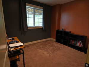 Carpeted home office with baseboards