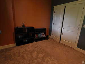 Bedroom with carpet floors and a closet