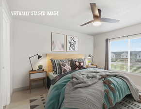 Bedroom featuring ceiling fan and carpet floors