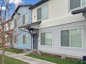 Modern townhome with a covered front porch.