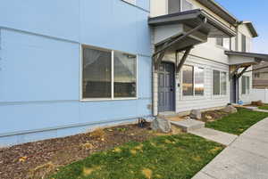 Property entrance featuring a lawn