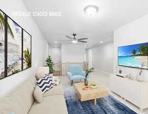 Living area featuring a ceiling fan and recessed lighting
