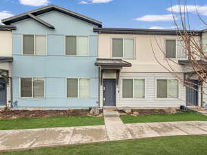 Large windows and a covered front porch.