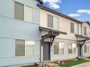 View of front facade featuring stucco siding