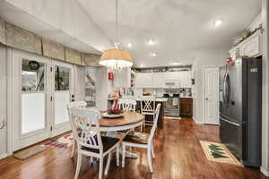 Kitchen area featuring recessed lighting, dark wood finished floors