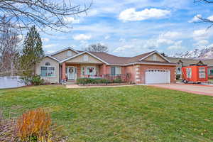 Ranch-style home with an attached garage, and a newer shingled roof (2018)