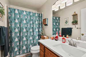 Hall bathroom featuring vanity and shower