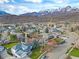 Aerial perspective of suburban area with a mountain backdrop