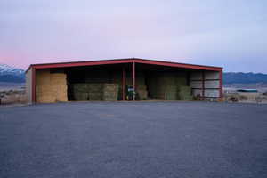 View of pole building with a mountain view