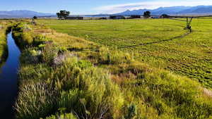 View of mountain backdrop featuring rural landscape and a pastoral area