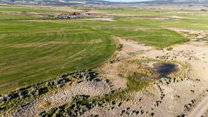Aerial view of property's location with a mountainous background