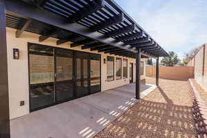 Fenced backyard featuring a patio area and a pergola