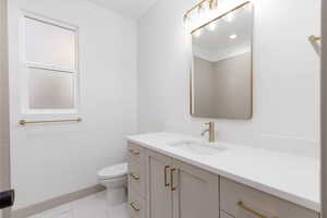 Bathroom with vanity and toilet
