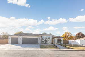 Prairie-style home with concrete driveway, a garage, and brick siding