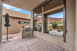 View of patio with an outdoor kitchen and a mountain view
