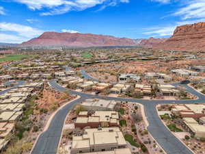 Aerial view of residential area featuring a mountainous background