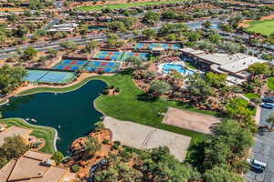 Aerial overview of property's location featuring a local golf course and a large body of water