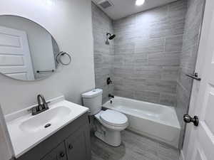 Bathroom featuring vanity, shower / bathtub combination, and recessed lighting
