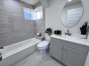 Full bathroom featuring vanity and shower / washtub combination
